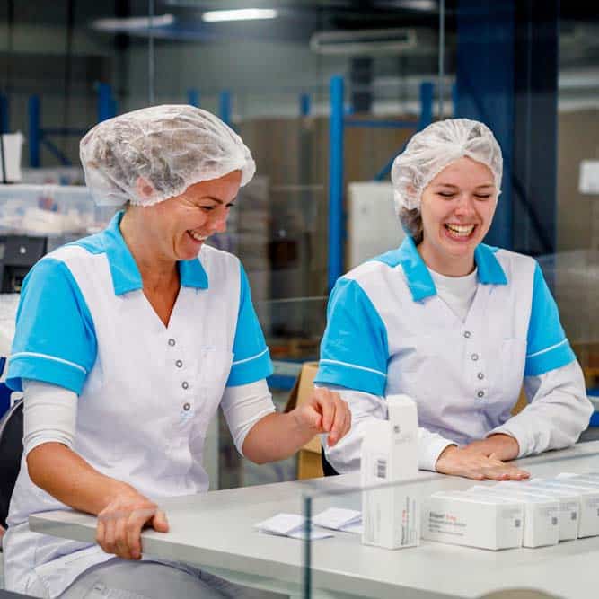 Two women working in Abacus Medicine's warehouse in the Netherlands